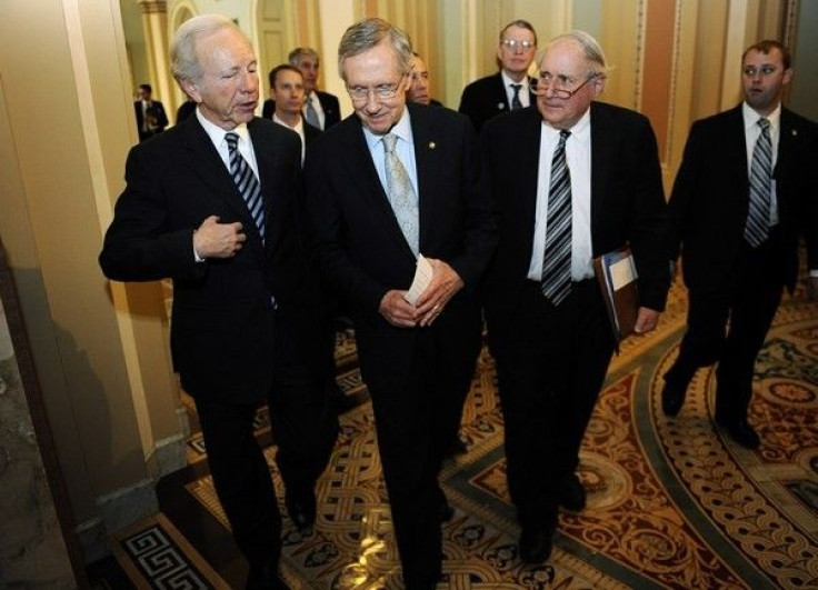 U.S. Senators, left to right, Joseph Lieberman, I-CT, Senate Majority Leader Harry Reid, D-NV, and Carl Levin, D-MI,  (D-MI)  at the U.S. Capitol in Washington, December 18, 2010.