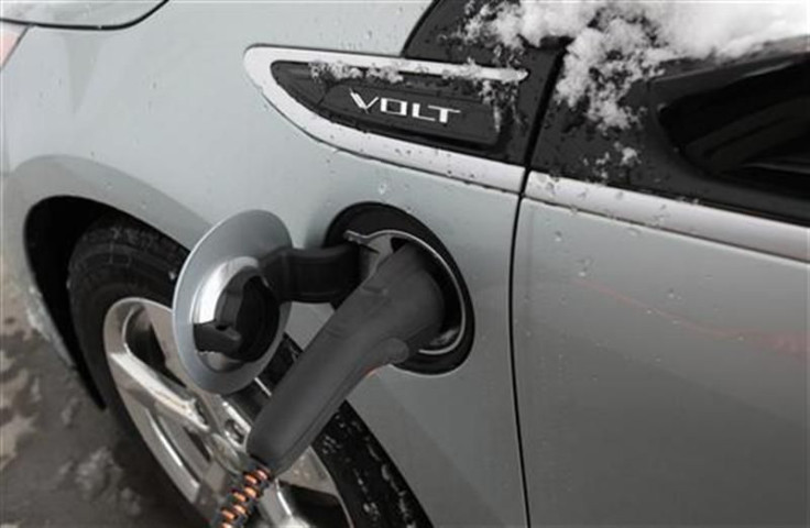 A 2012 Chevrolet Electric Volt gets charged at a charging station at a Chevrolet car sales lot in Troy, Michigan