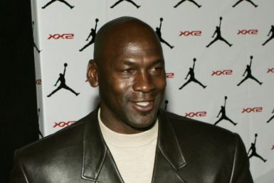 Michael Jordan holds Air Jordan XX2 during launch party in Las Vegas