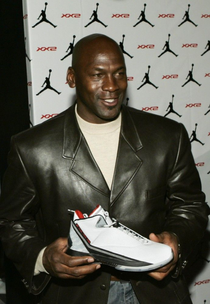 Michael Jordan holds Air Jordan XX2 during launch party in Las Vegas
