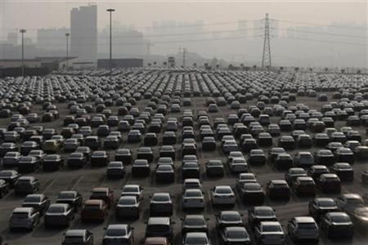 New cars are seen at a parking lot of Changan Ford Mazda Automobile Co. Ltd, Ford Motor&#039;s joint venture in China, in Chongqing Municipality
