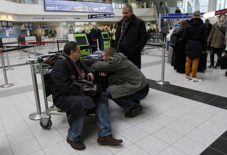 People wait at Ferenc Liszt International Airport in Budapest