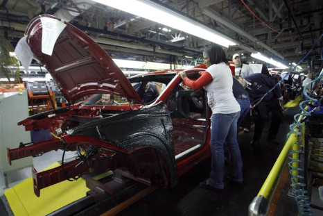 Workers assemble a pre-production 2013 Dodge Dart during a tour of the Chrysler Belvidere Assembly plant in Belvidere