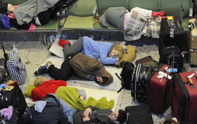 Passengers sleep on makeshift beds in Terminal 3 at Heathrow Airport in west London