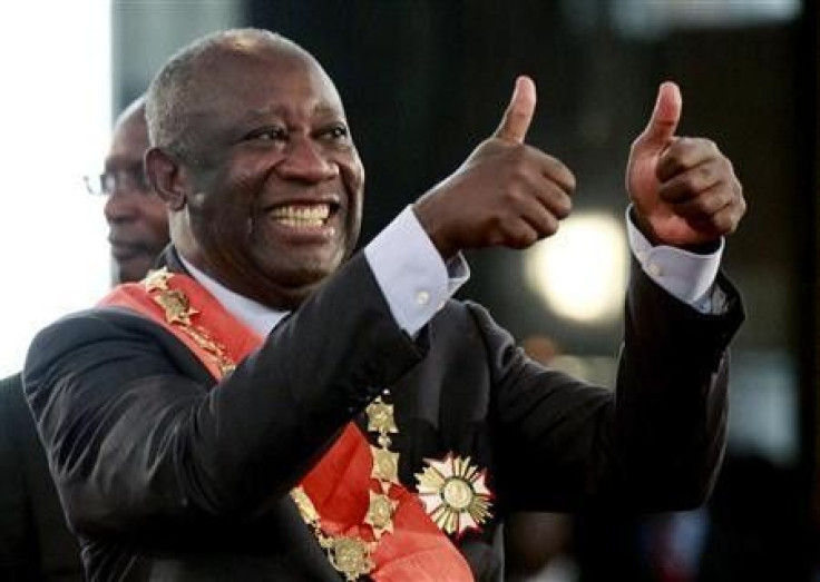 Ivory Coast's President Laurent Gbagbo flashes two thumbs-up during his inauguration at the presidential palace in Abidjan