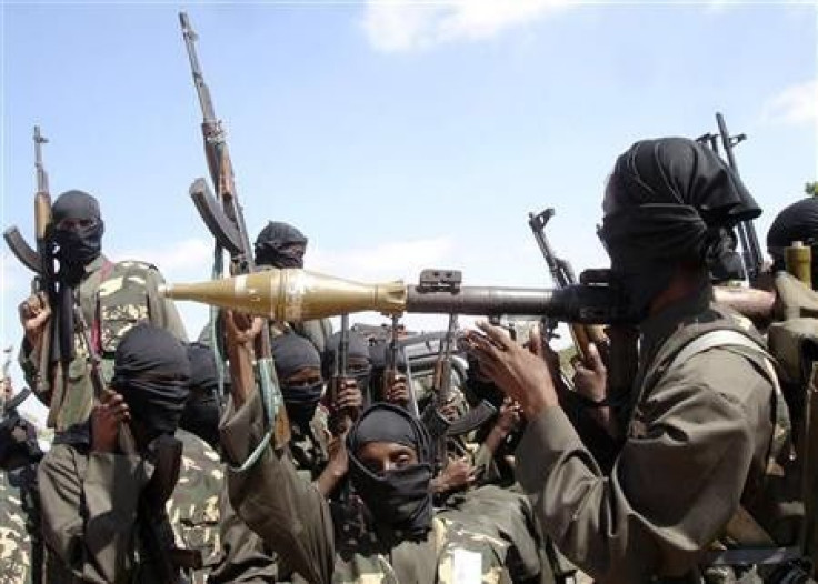 Militants of al Shabaab display their weapons on the outskirts of Mogadishu