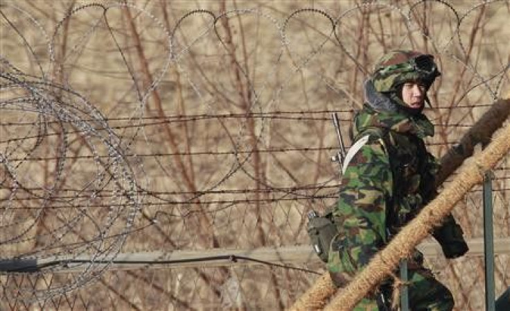 A South Korean Army soldier walks up steps of a guard post near the demilitarised zone separating the two Koreas.