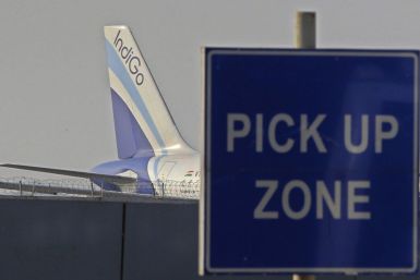 An IndiGo aircraft stands on tarmac at the airport in New Delhi January 12, 2011.