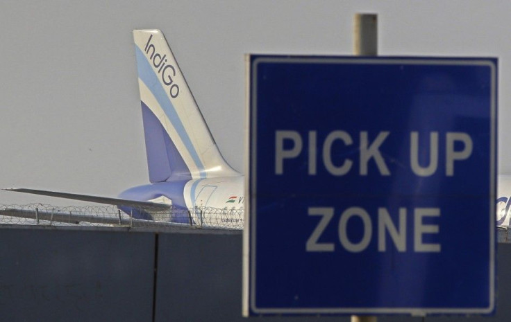 An IndiGo aircraft stands on tarmac at the airport in New Delhi January 12, 2011.