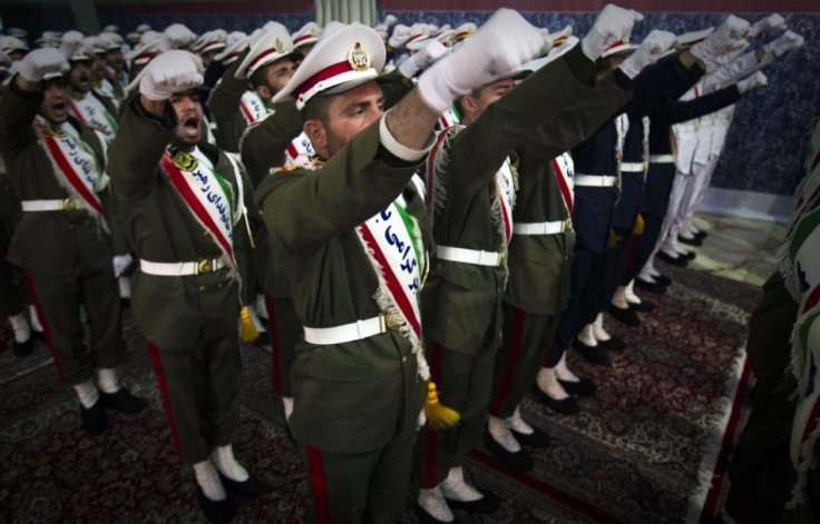Iranian soldiers shout anti-U.S. slogans during the anniversary ceremony of Iran&#039;s Islamic Revolution at the Khomeini shrine in the Behesht Zahra cemetery, south of Tehran, February 1, 2012.