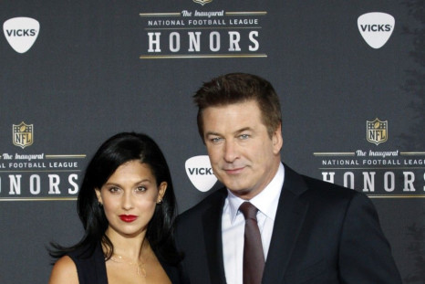 Host Alec Baldwin (R) and girlfriend Hilaria Thomas arrive for the Inaugural National Football League Honors at Super Bowl XLVI in Indianapolis, Indiana