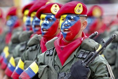 Venezuelan soldiers march during a military parade to commemorate the 20th anniversary President Hugo Chavez&#039;s failed coup attempt in Caracas February 4, 2012.