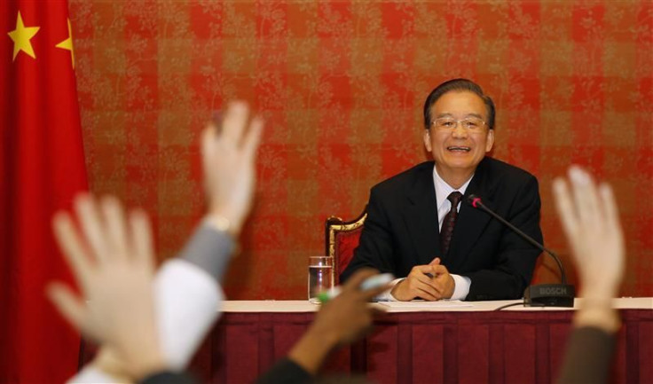 Chinese Premier Wen Jiabao reacts during a news conference in Doha
