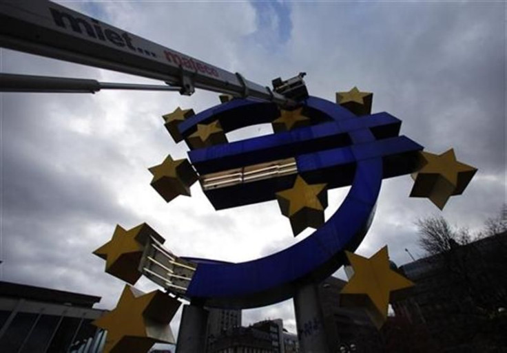 Workers maintain the huge Euro logo next to headquarters of ECB in Frankfurt