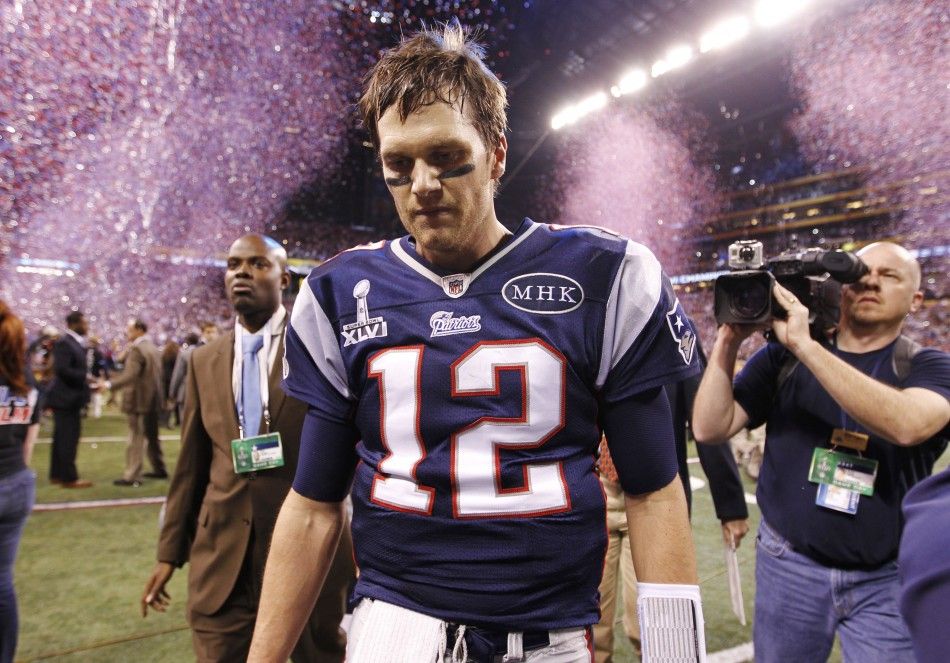 New England Patriots quarterback Tom Brady leaves the field after their loss to the New York Giants in the NFL Super Bowl XLVI football game in Indianapolis, Indiana