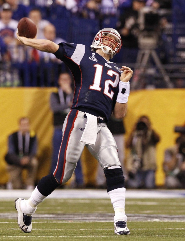 New England Patriots quarterback Tom Brady throws an interception against the New York Giants during the fourth quarter in the NFL Super Bowl XLVI football game in Indianapolis, Indiana