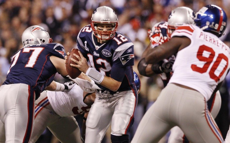 New England Patriots quarterback Tom Brady scrambles against the New York Giants during the second quarter in the NFL Super Bowl XLVI football game in Indianapolis, Indiana