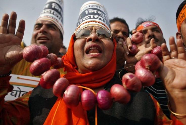 An activist from India's main opposition BJP wearing an onion garland shouts slogans during a protest in New Delhi