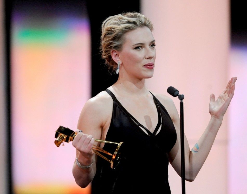 US actress Scarlett Johansson holds her trophy for Category quotBest International Actressquot during the 47th Golden Camera award ceremony in Berlin February 4, 2012. The Golden Cameras Goldene Kamera are awarded by a popular German TV-magazine hon