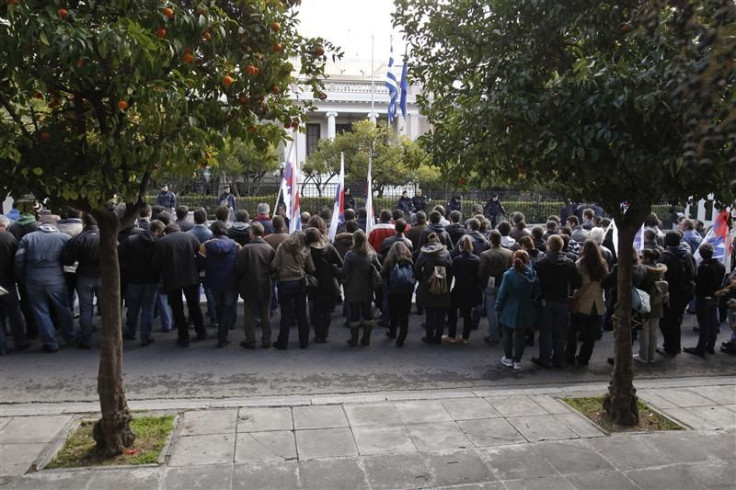 Demonstrators from the communist-affiliated trade union PAME protest outside the Greek Prime Minister&#039;s office in Athens