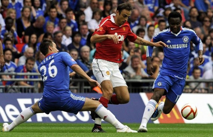 Chelsea's Terry and Mikel challenge Manchester United's Berbatov during their English Community Shield soccer match at Wembley Stadium in London.