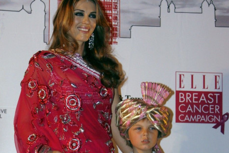 British actress Hurley poses with her son Damian during an event for the Breast Cancer Awareness in Mumbai