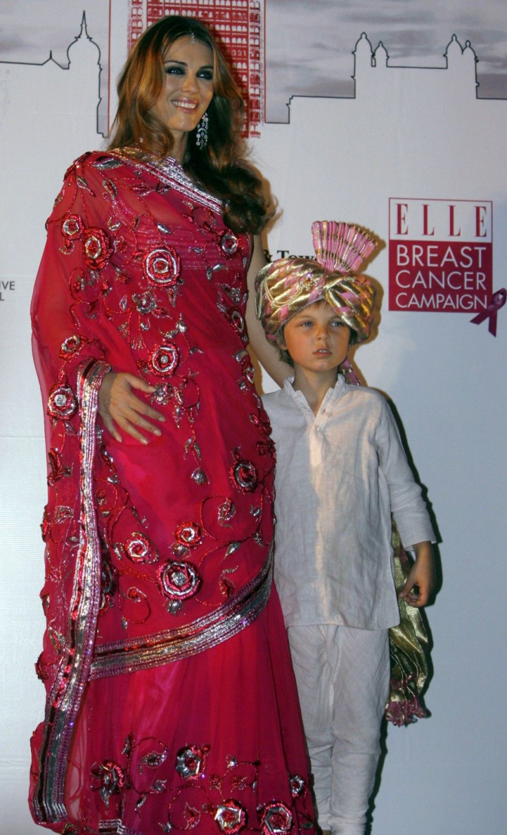 British actress Hurley poses with her son Damian during an event for the Breast Cancer Awareness in Mumbai