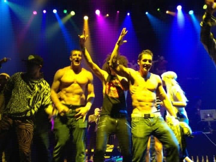 Patriots tight end Rob Gronkowski shirtless with LMFAO after the Super Bowl.