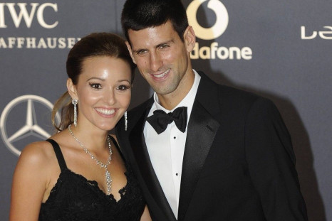 Tennis Player Novak Djokovic (R) and his girlfriend Jelena Ristic pose for photographs as they arrive for the the Laureus World Sports Awards 2012 in central London February 6, 2012.