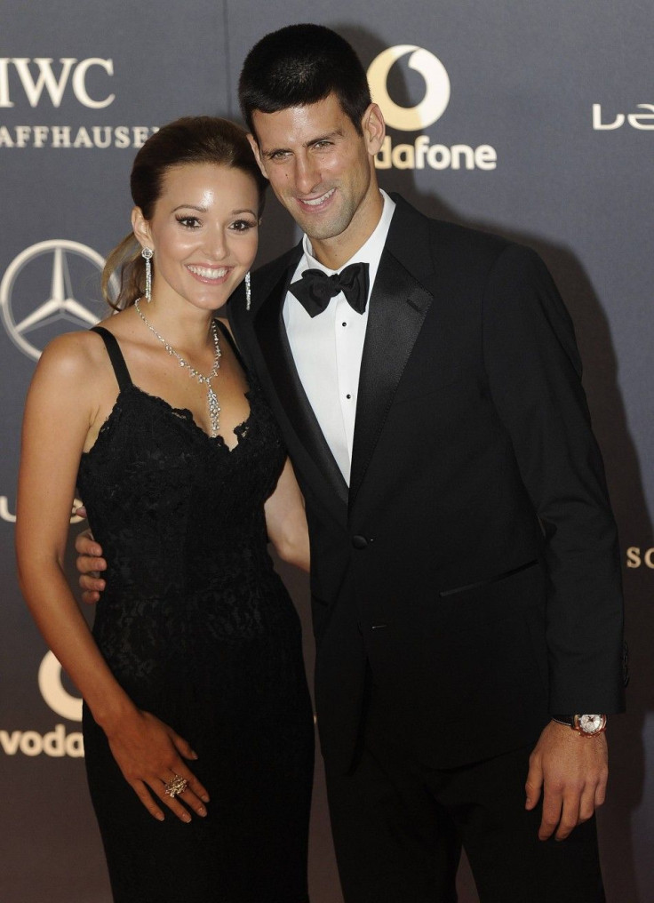 Tennis Player Novak Djokovic (R) and his girlfriend Jelena Ristic pose for photographs as they arrive for the the Laureus World Sports Awards 2012 in central London February 6, 2012.