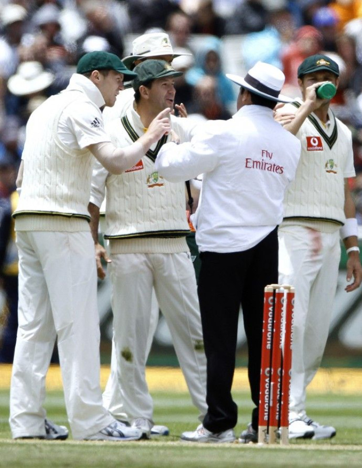 Australia's Ponting speaks to umpire Dar after an unsuccessful review during the second day of the fourth Ashes cricket test against England at the Melbourne Cricket Ground.