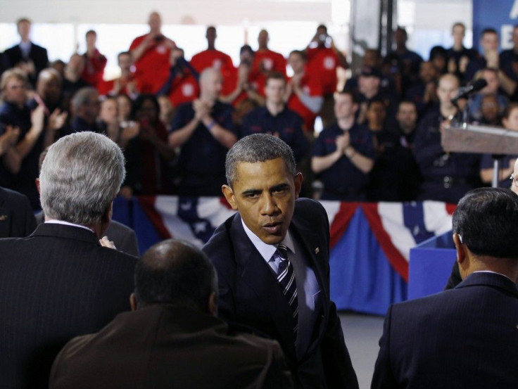 U.S. President Barack Obama shakes hands after speaking about the economy in Arlington