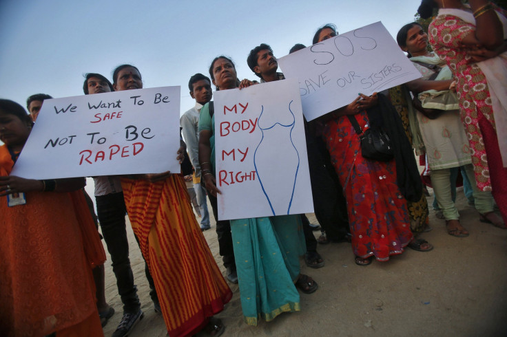 Demonstrators hold placards as they take part in a protest rally in solidarity with a rape victim from New Delhi in Mumbai