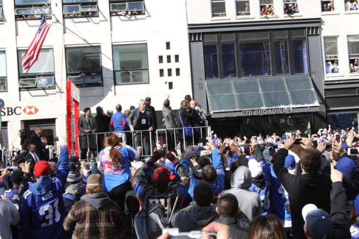 Eli Manning and Justin Tuck spoke to fans as the parade moved to City Hall.