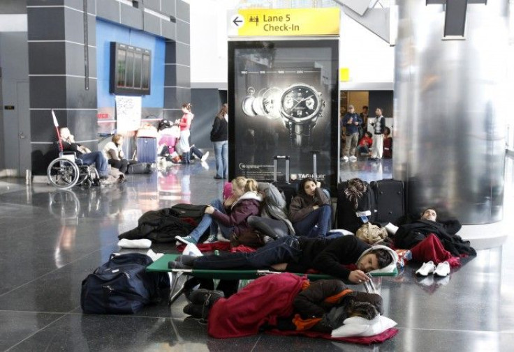 Passengers stranded at JFK International Airport wait for the airport to reopen in New York
