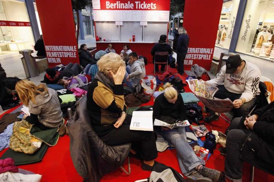 People are seen outside a ticket office, waiting to buy tickets for the upcoming 62nd Berlinale International Film Festival in Berlin February 6, 2012. The February 9-19 Berlinale kicks off the European festival season.