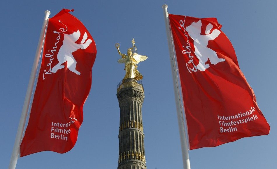 Flags advertising the 62nd Berlinale International Film Festival flutter next to the victory column in Berlin February 6, 2012. The February 9-19 Berlinale kicks off the European festival season.