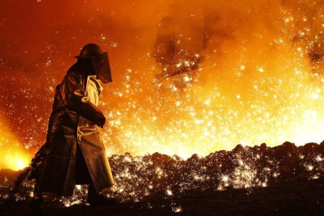 A worker controls the cast at a blast furnace at a steel manufacture