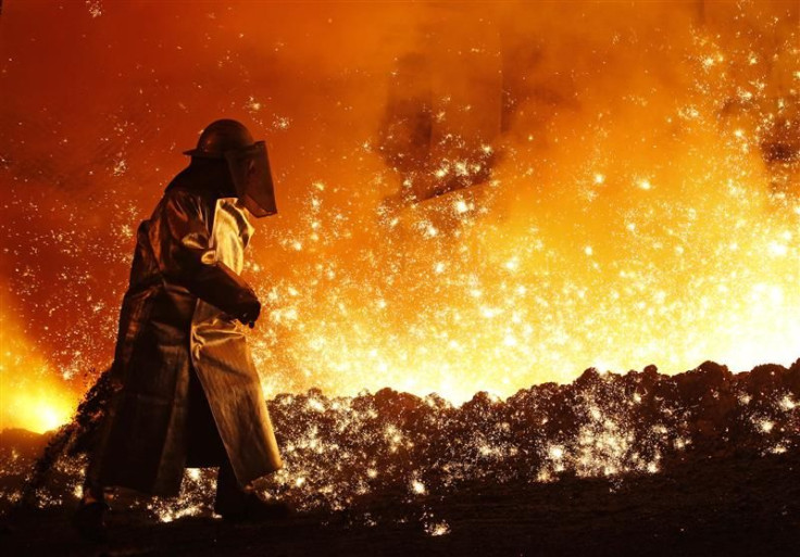 A worker controls the cast at a blast furnace at a steel manufacture