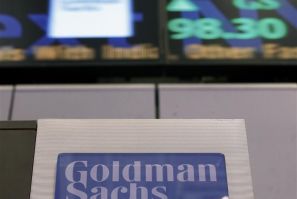 A Goldman Sachs sign is seen on at the company's post on the floor of the New York Stock Exchange