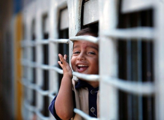 Six-year-old Naidu sits inside a carriage at a railway station in Bangalore
