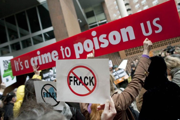People protest against hydraulic fracturing outside the Tribeca Performing Arts Center in New York