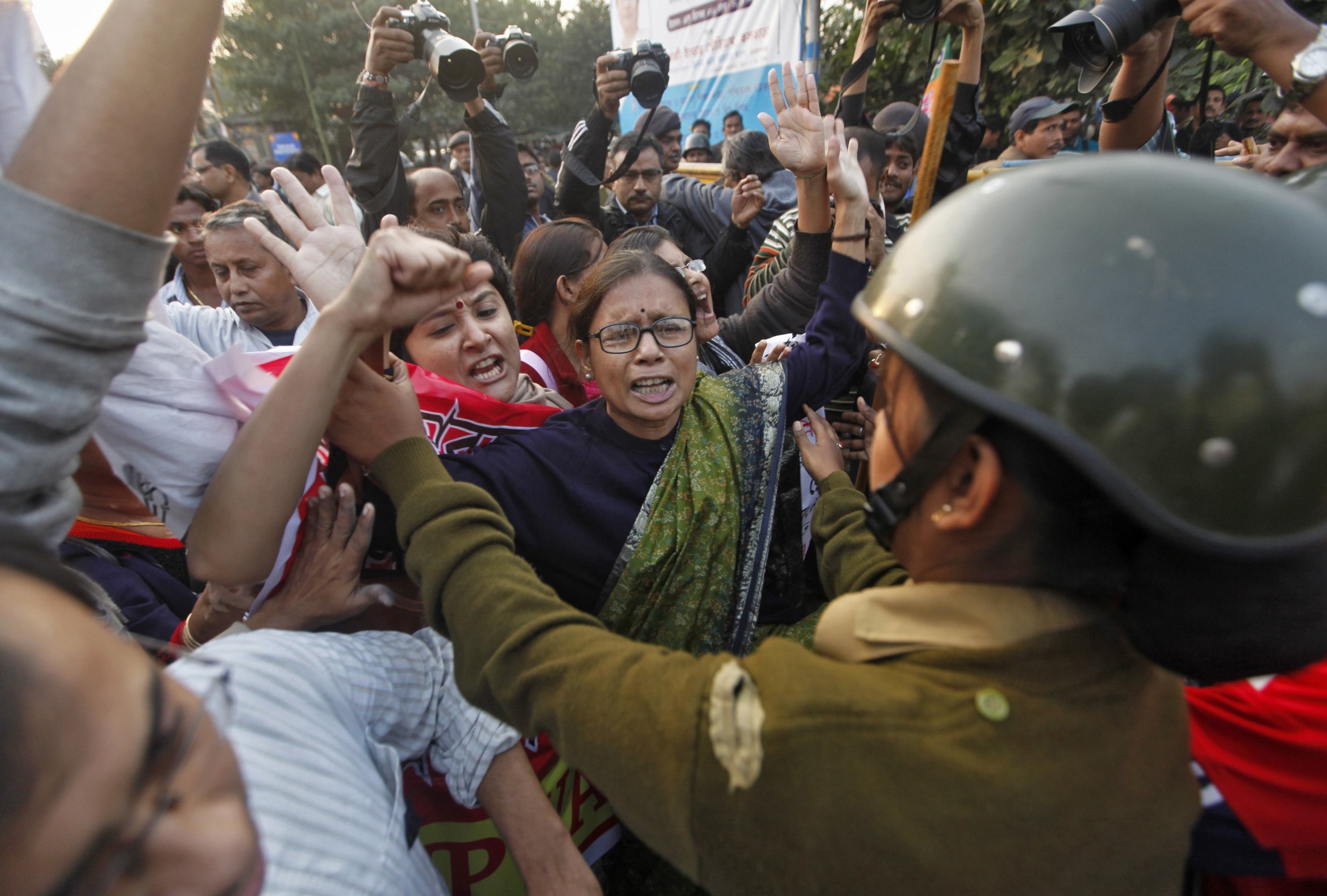 Delhi Gang-Rape Victim Cremated Amid Tight Security Protests Continue  