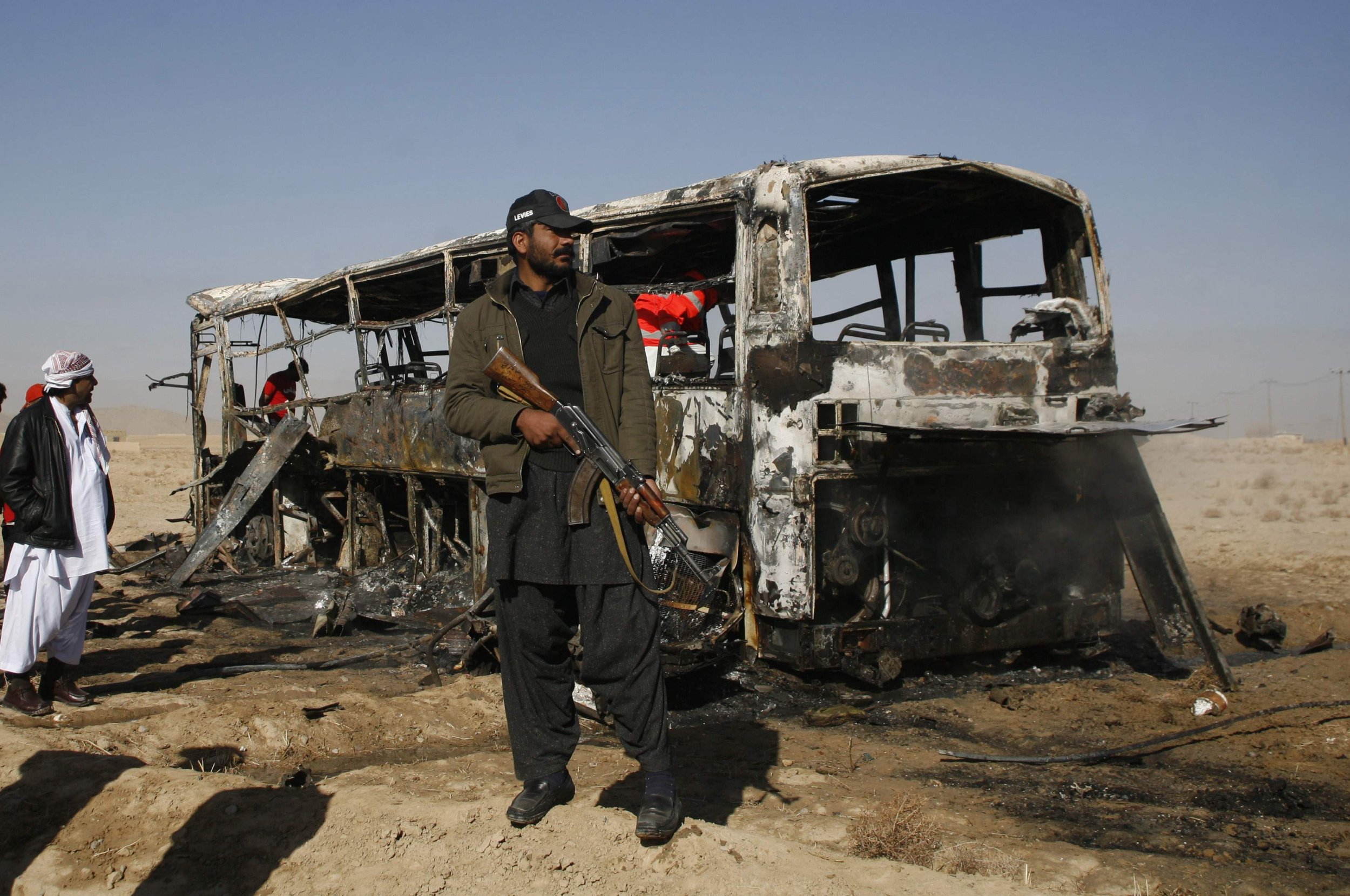 Paramilitary soldier stands guard at the site of a bomb explosion in Quetta