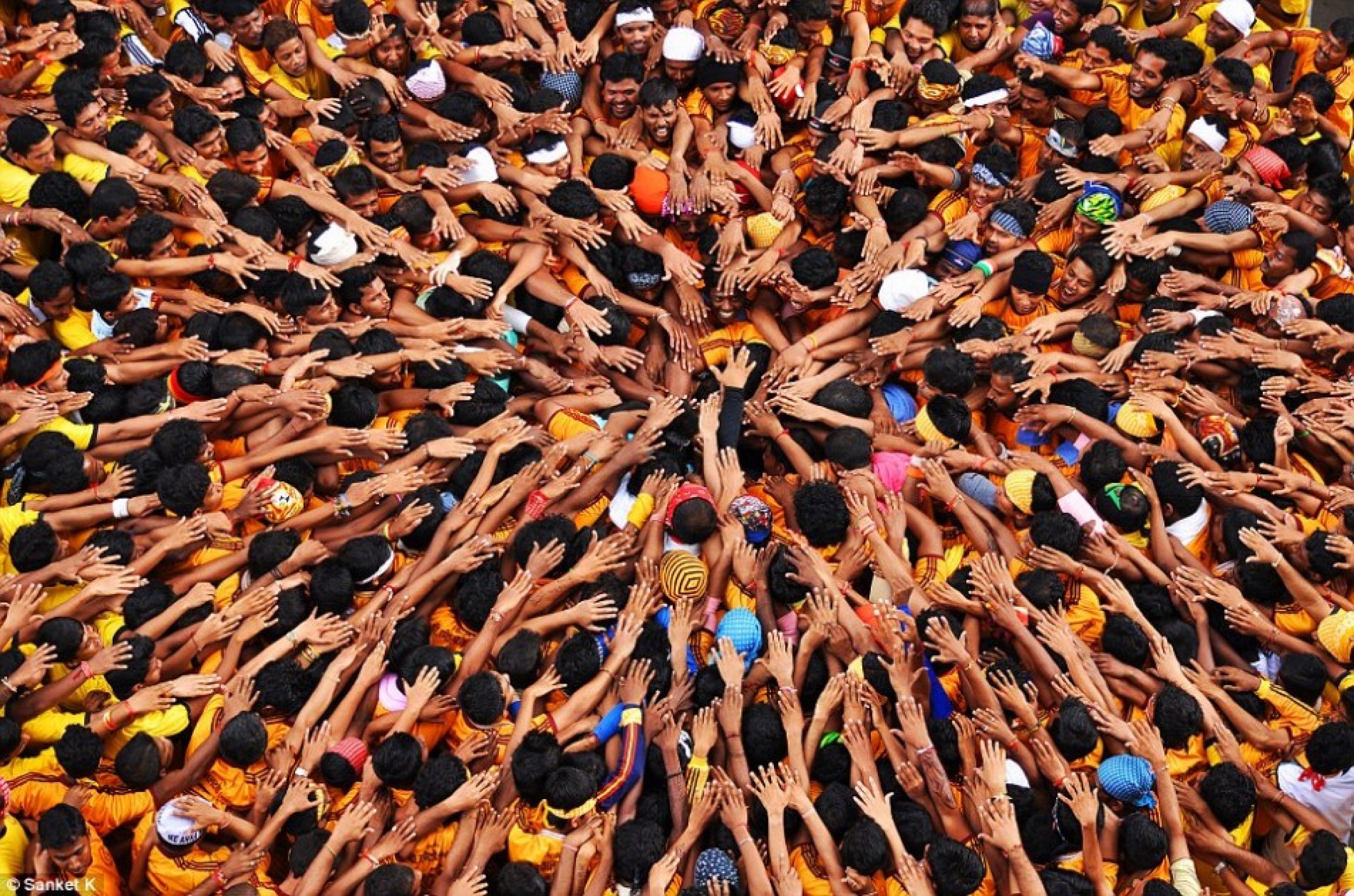 A sea of arms makes up this well-composed image taken as people celebrate during the Indian Festival in Mumbai.
