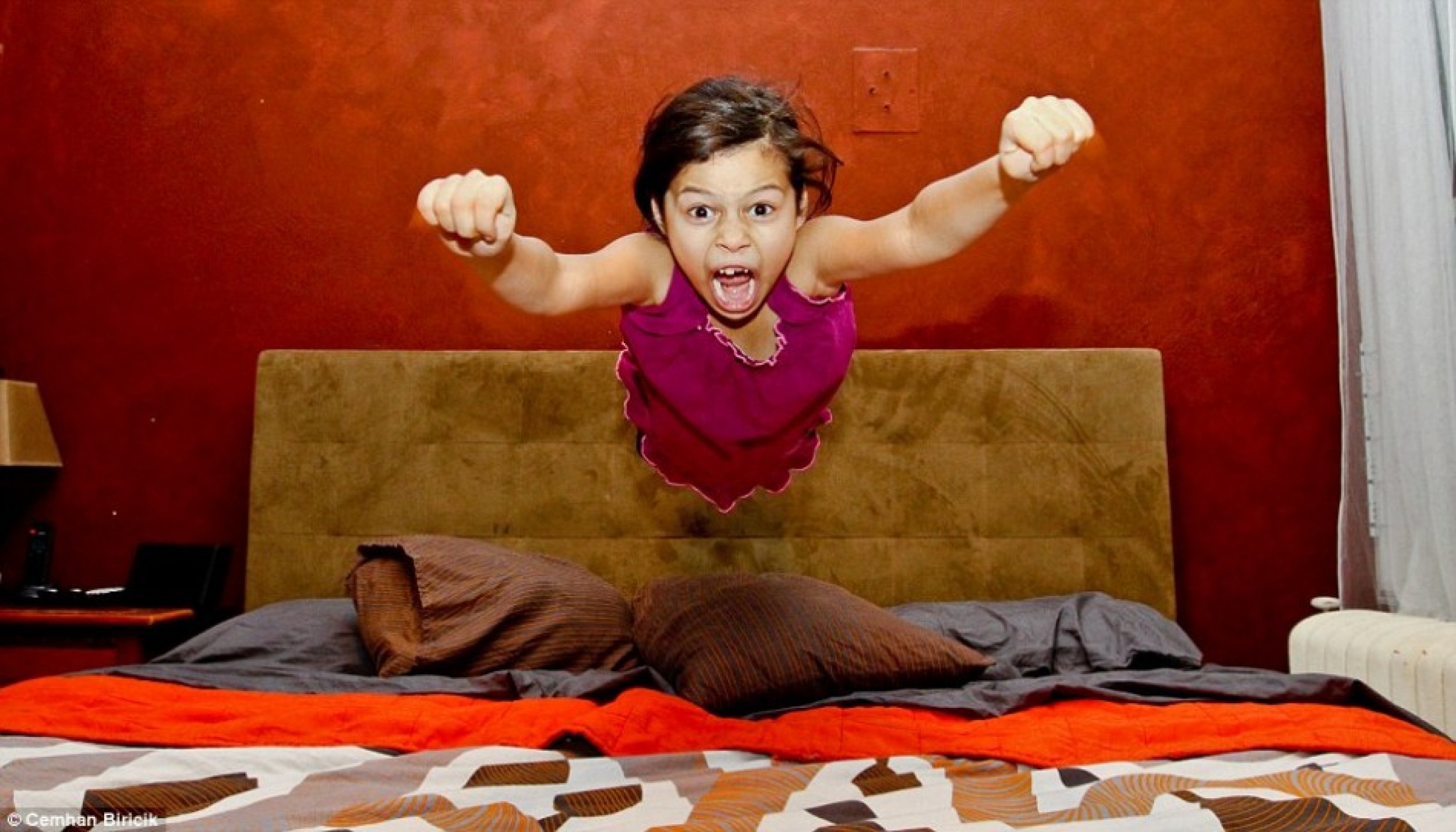 A young girl appears suspended in mid-air in the split second category