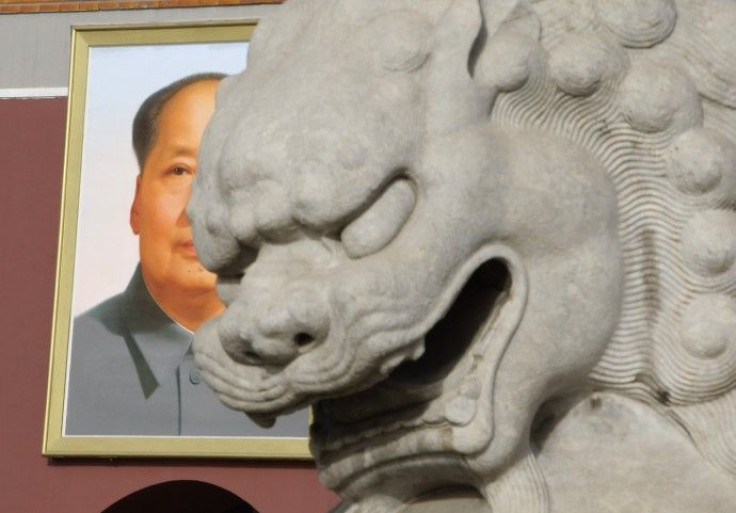 A stone lion is pictured in front of a portrait of the late chairman Mao Zedong at Tiananmen Gate in Beijing