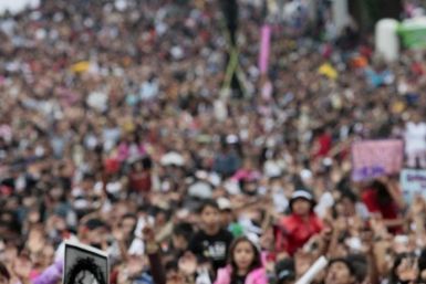Michael Jackson fans hold up his poster in Mexico City August 29, 2009