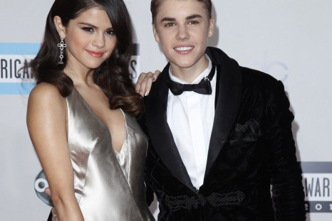 Justin Bieber and his girlfriend, singer Selena Gomez clearly in love at The 2011 American Music Awards in Los Angeles