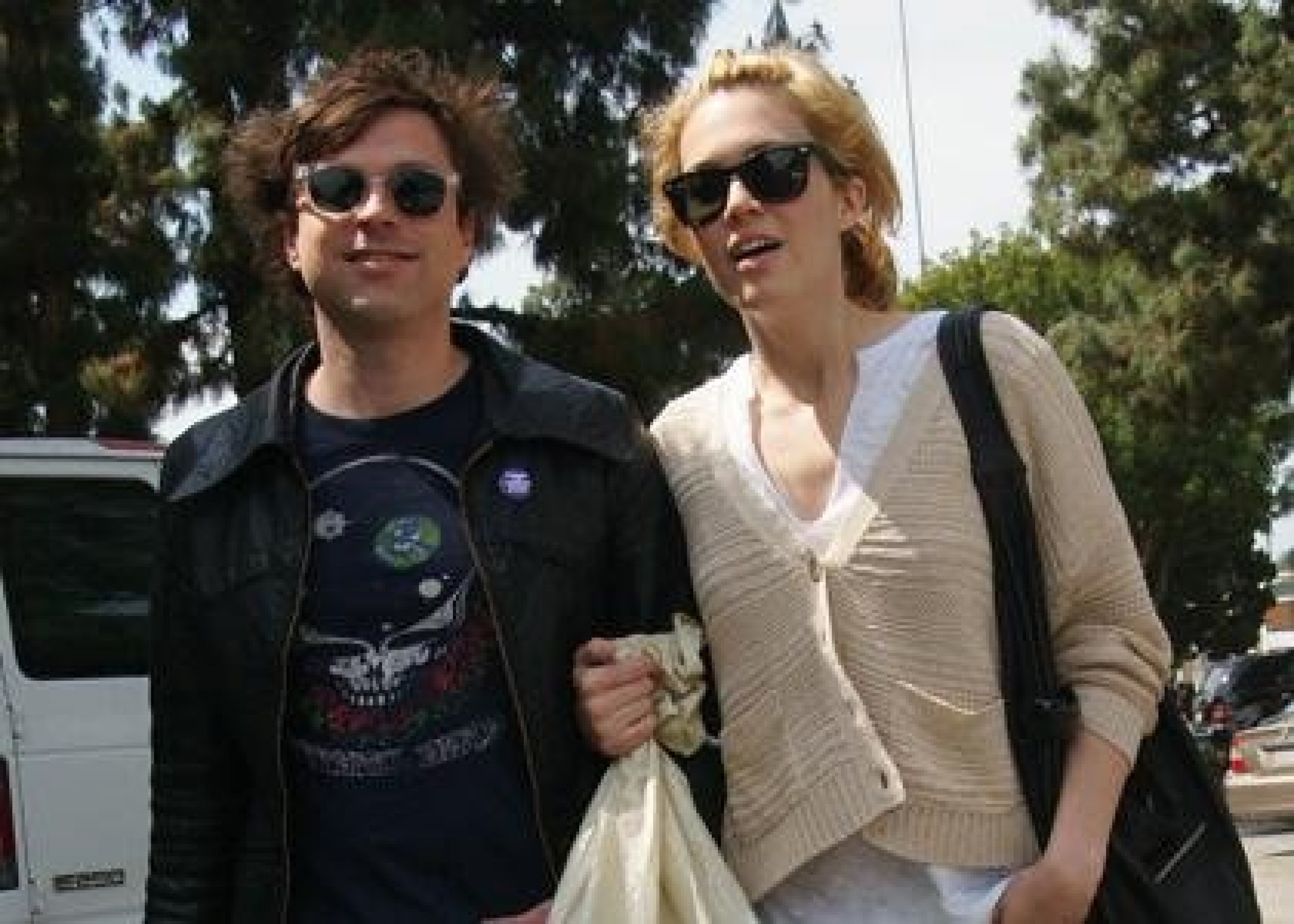Mandy Moore and husband Ryan Adams arm in arm at a flea market